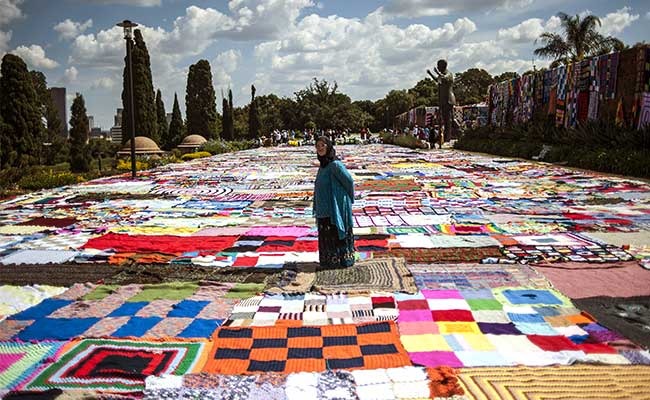 Stitching Smiles: World's Largest Happy Blanket Unfolds to Celebrate Mandela's Legacy