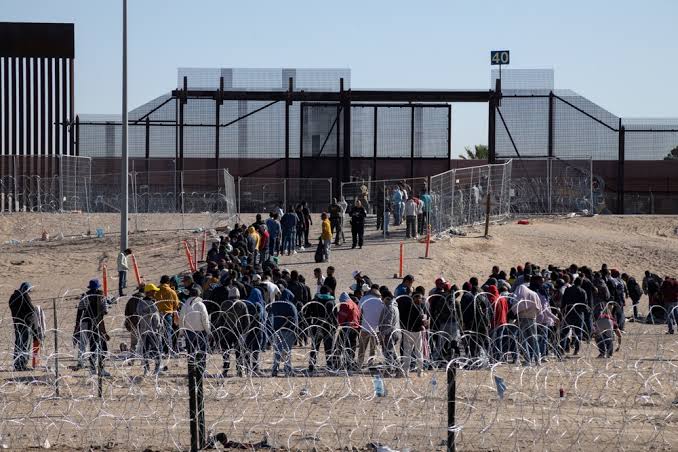 Trump's First 100 Days: Migrants Urged to Leave Amid Sweeping Immigration Crackdown
