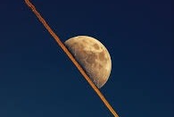 Split-Second, Split Moon: Flight Slices Lunar Disc in Astonishing Kerala Photograph