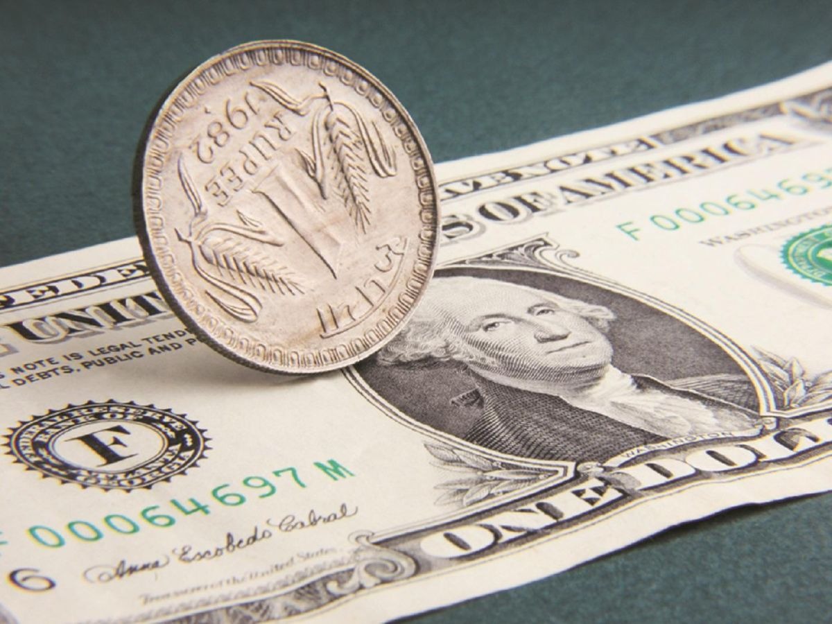 Rupee Holds Its Ground, Closes Nearly Flat Against The Dollar