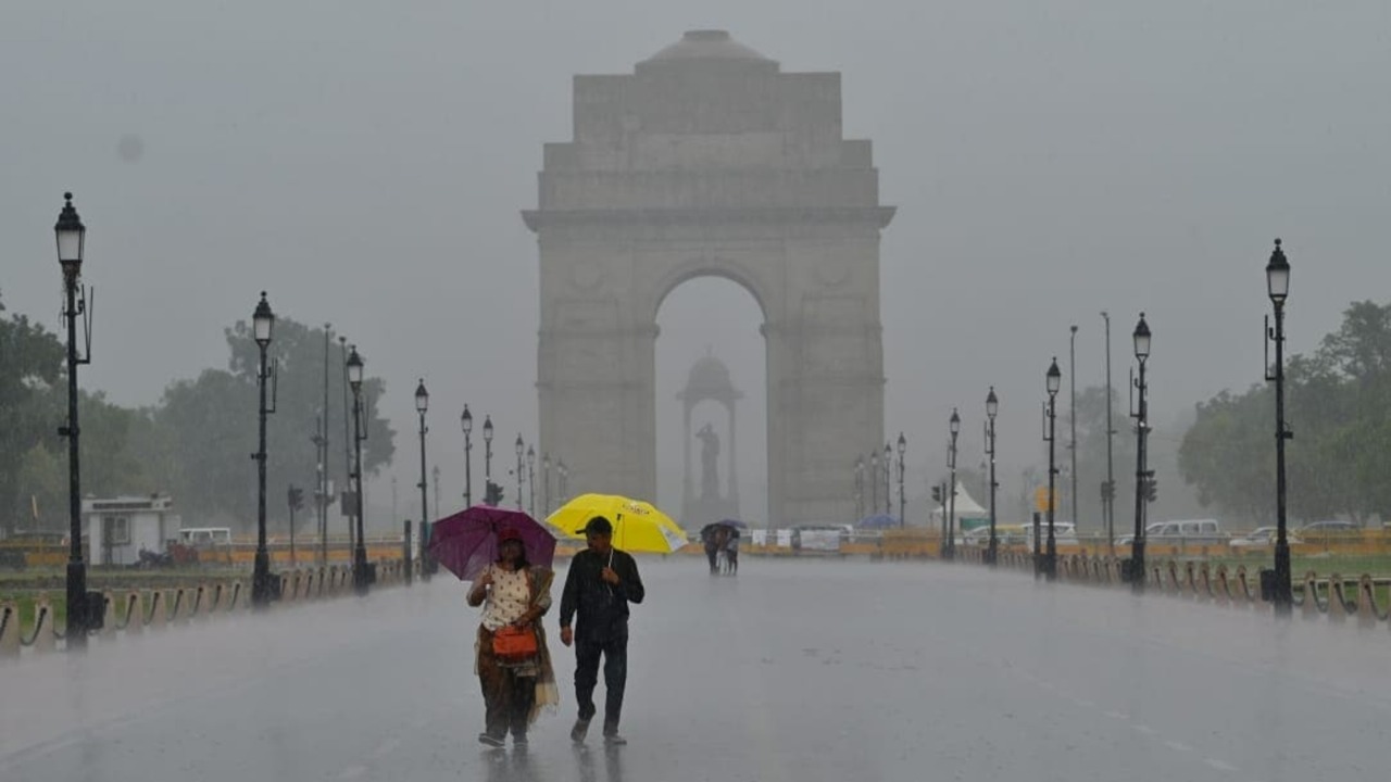 Umbrellas Up, Engines Down: Rain Turns Delhi into a Water Maze